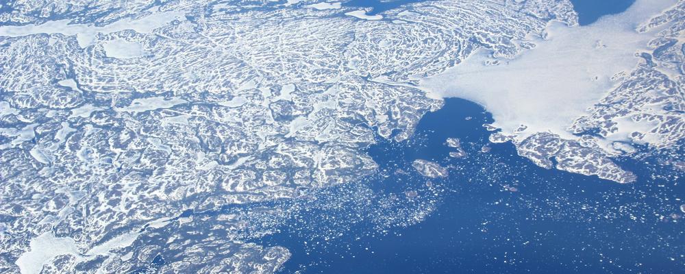 Aerial view of mountains and ice in Greenland